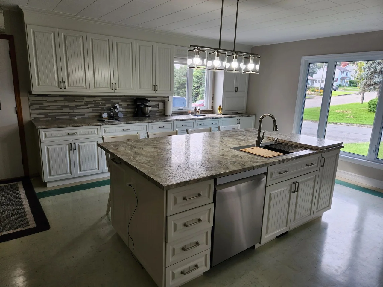 Painted cabinetry and a generous kitchen island