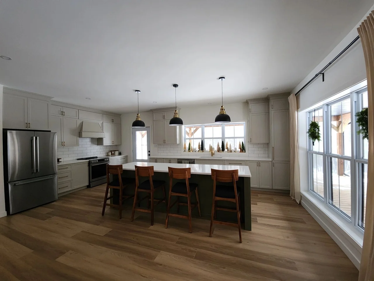 White kitchen opening onto a dining space