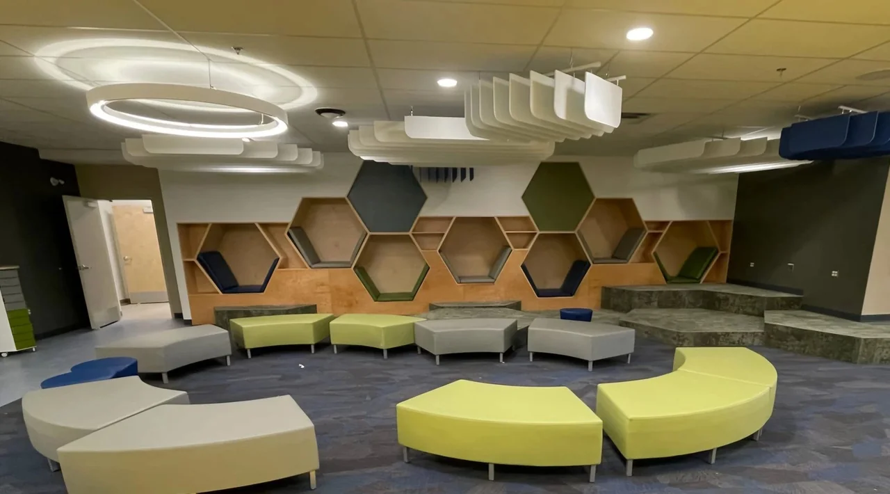 Geometric wood wall features in a shared space